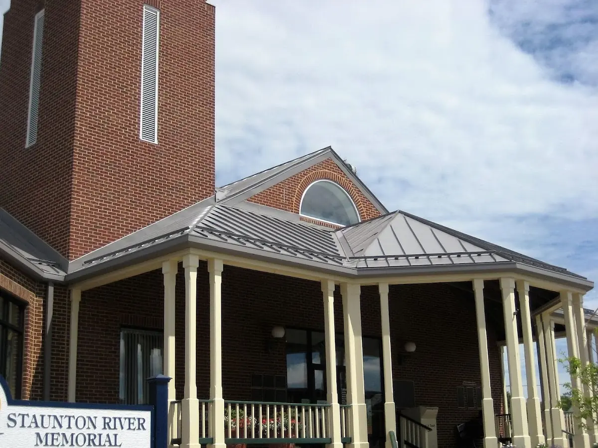 Skilled roofing craftsmen working on a residential roof in Fostertown